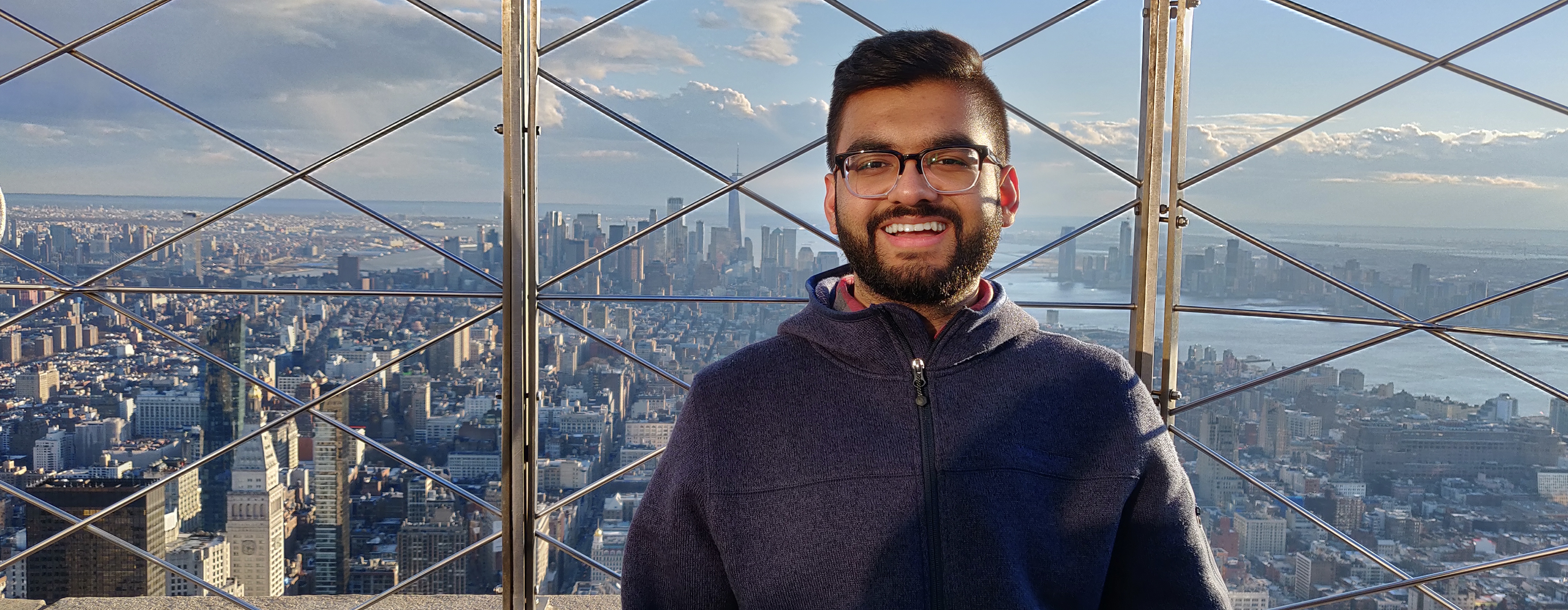 Zohaib standing on top of the Empire State Building in Manhattan, Ny